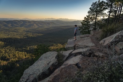 The man standing on the rock
